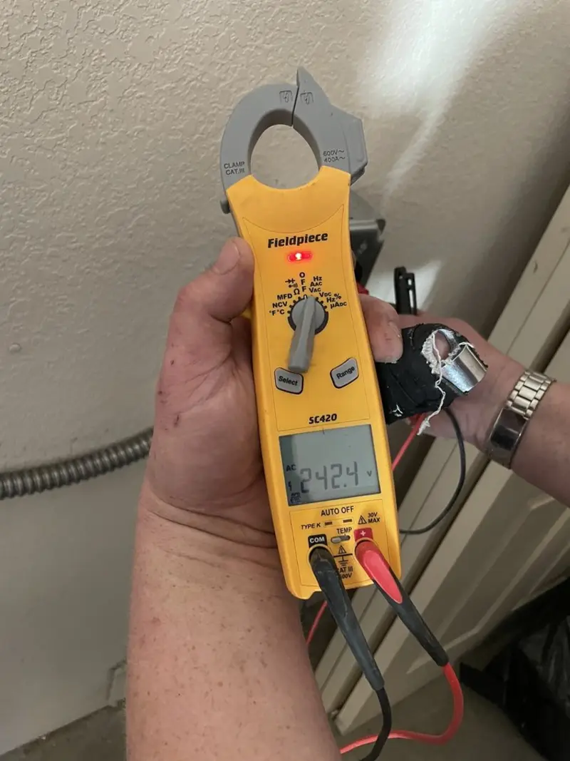 Voltage testing with clamp meter during Whole House Surge Protector in Austintown